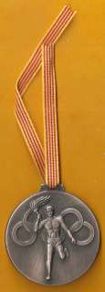 This medal was given as a gift to the public during the olympic torch 