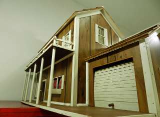 Vintage Two story wood Dollhouse with a roll top door garage  