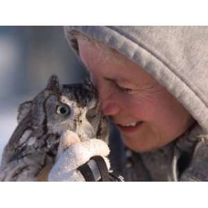  A Woman Holds an Endangered Eastern Screech Owl at a 