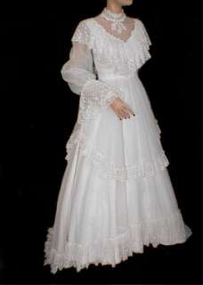 This 70s wedding dress features a shawl collar and poet sleeves, in a 