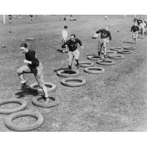  West Points football squad limbering up by skipping 