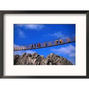  Hikers Crossing Steel Suspension Bridge Over Crevasse 