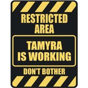   RESTRICTED AREA TAMYRA IS WORKING  PARKING SIGN