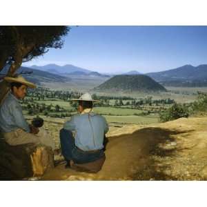  Farmers Sit in Shade Overlooking Fields and Cinder Cone 