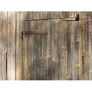  Weathered Wooden Door and Wall with Rusted Brass Hinge 