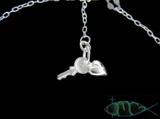 Close up of the Heart & Key Charms and a chain segment; both in 