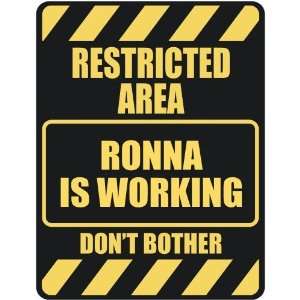   RESTRICTED AREA RONNA IS WORKING  PARKING SIGN