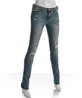 style #303457001 medium faded and distressed Straw Legging jeans