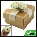 off white flower embellished square shaped gold tone paper gift