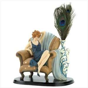  LADY IN CHAIR FIGURINE
