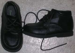 This is a pair of boys black leather high top shoes; there is very 
