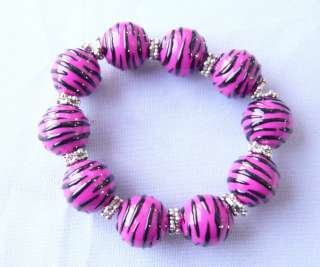 You are bidding on Animal Print Hot Pink Strip Resin Bead Bracelet New 