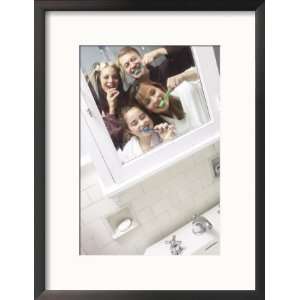 Smiling Family Brushing Their Teeth Together in Bathroom Mirror Framed 