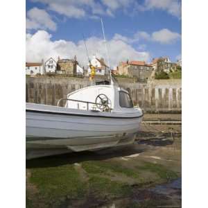 White Boat on the Landing in Harbour at Low Tide with Old Bay Area of 