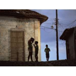  People in Silhouette on a Street in Trinidad, Cuba, West 